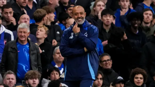 Nuno Espirito Santo smiles as he watches Nottingham Forest at Chelsea