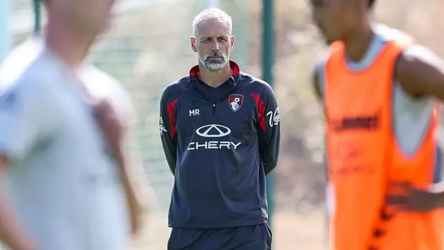Head coach Marco Rose of Bournemouth looks on wearing a blue tracksuit top
