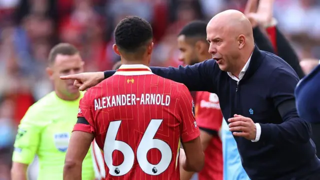 Arne Slot instructs Trent Alexander-Arnold