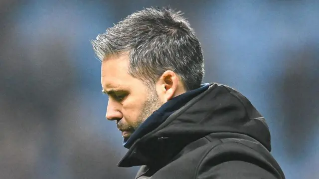 A photo of Marti Cifuentes looking down