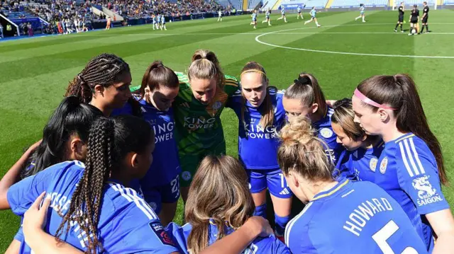 Leicester City's players in a team huddle