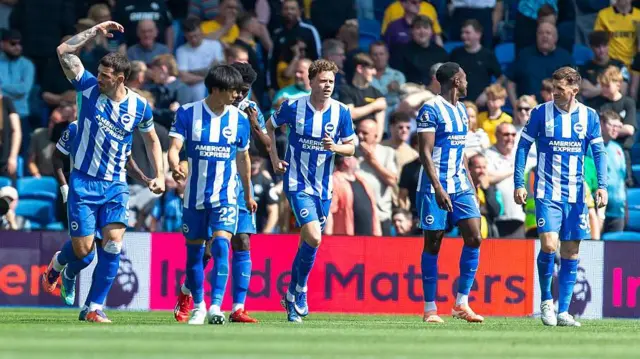 Lewis Dunk of Brighton celebrates scoring a goal
