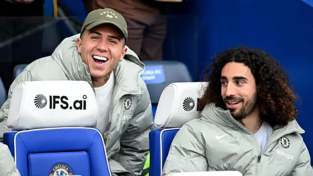 Enzo Fernandez and Marc Cucurella of Chelsea react on the bench prior to the FA Cup quarter-final match between Chelsea and Port Vale