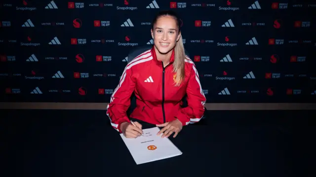 Andrea Medina signing contract 