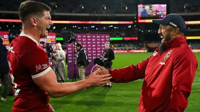 Owen Farrell laughs with Bundee Aki