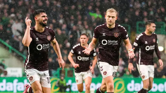 Claudio Braga celebrates scoring at Celtic Park