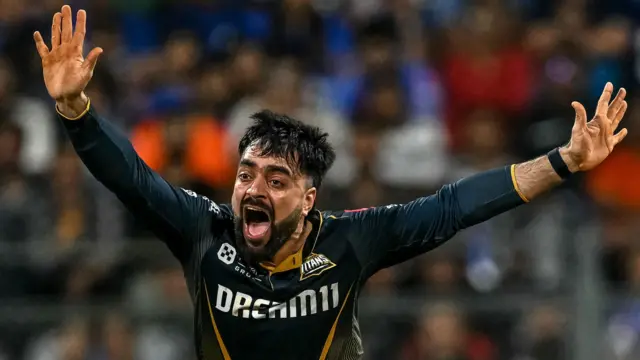 Rashid Khan appeals for a wicket while playing for Gujarat Titans