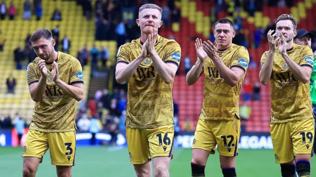 Scott Wharton leads the celebrations for Blackburn at Vicarage Road 