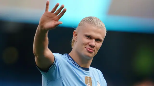 Erling Haaland waves to Manchester City supporters