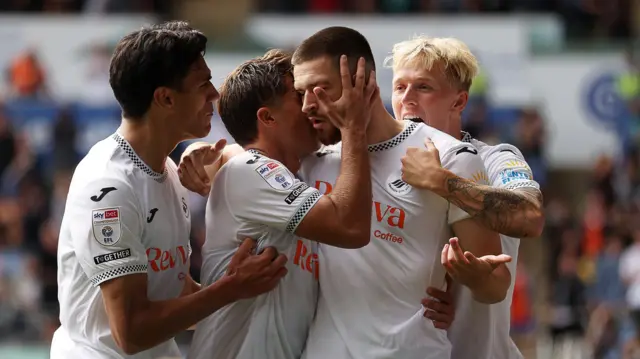 Zan Vipotnik celebrates with team-mates