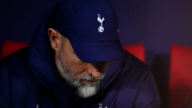 Igor Tudor looks down dejectedly underneath Tottenham baseball cap