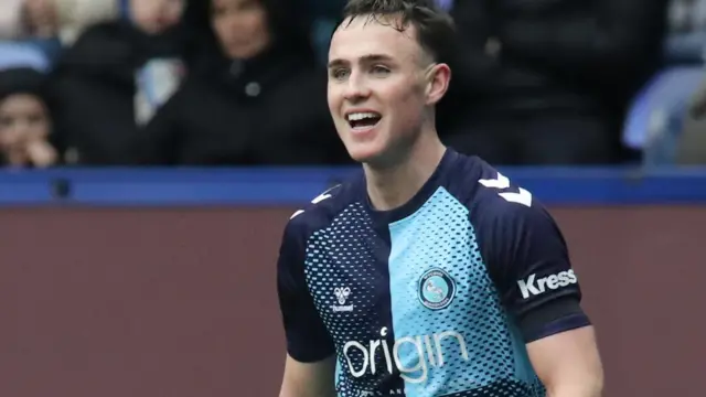 Luke Harris in action for Wycombe Wanderers in a League One match last season