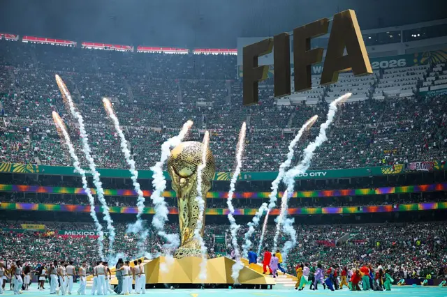 Fireworks going off around a huge replica of the World Cup trophy at the opening ceremony before Mexico v South Africa