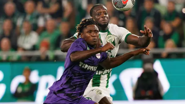 Georgios Antzoulas of Ujpest FC fights for the possession with Myenty Abena of Ferencvarosi TC during the Hungarian OTP Bank Liga match between Ferencvarosi TC and Ujpest FC