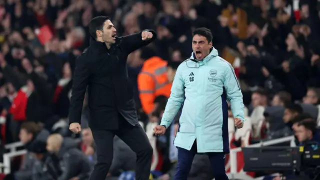 Arsenal manager Mikel Arteta celebrates victory with assistant coach Carlos Cuesta