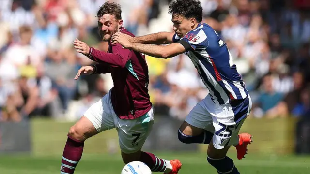 Jacob Brunn Larsen, of Burnley, is challenged by Nolan Galves, of West Brom