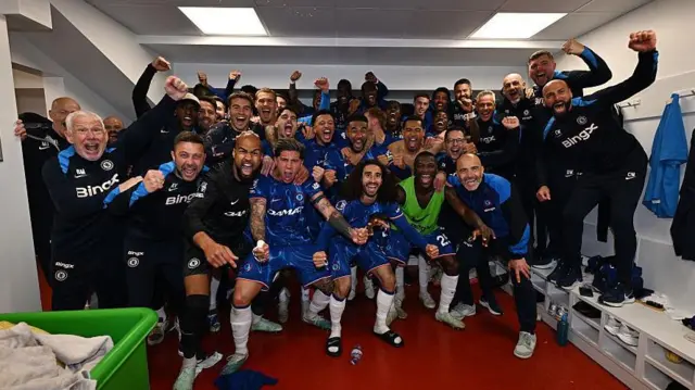Chelsea team and coaching staff in changing rooms