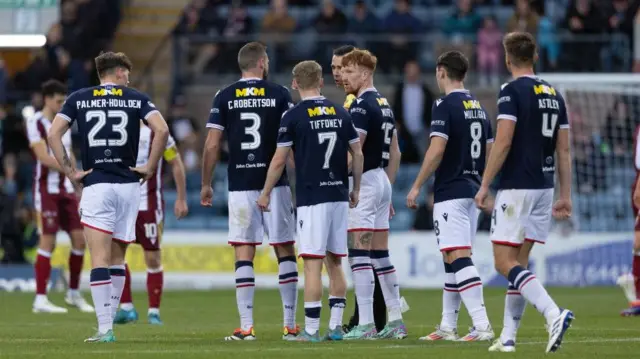 Dundee players surround Referee Kevin Clancy after St Johnstone score a late winner during a William Hill Premiership match between Dundee and St Johnstone at the Scot Foam Stadium at Dens Park, 