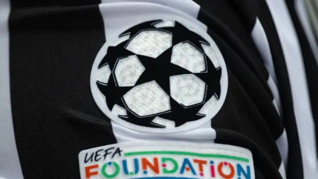 Champions League badge on a Newcastle kit