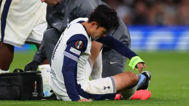 Son Heung-min sitting on the pitch