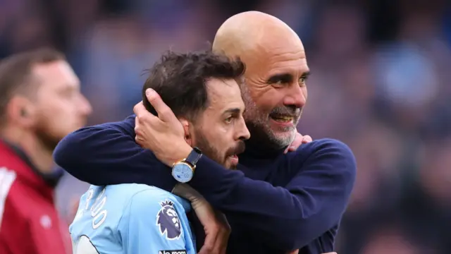 Pep Guardiola hugs Bernardo Silva