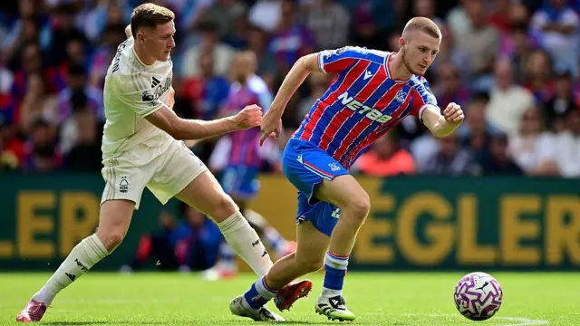 Elliot Anderson and Adam Wharton battle for the ball