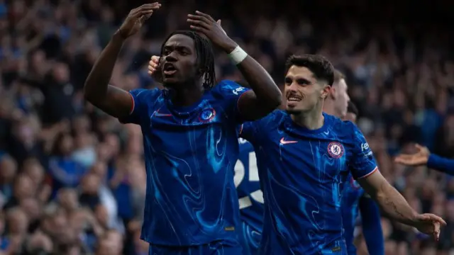 Romeo Lavia celebrating alongside Pedro Neto 