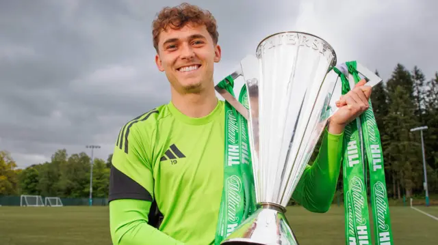 Celtic forward Callum Osmand with the Scottish Premiership trophy