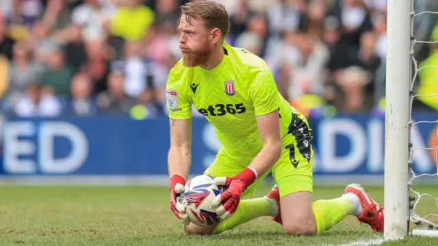 Stoke City goalkeeper Viktor Johansson holds the ball after making a save in the 0-0 draw at Derby