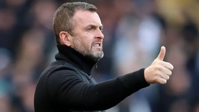 Charlton boss Nathan Jones holds his thumb up 