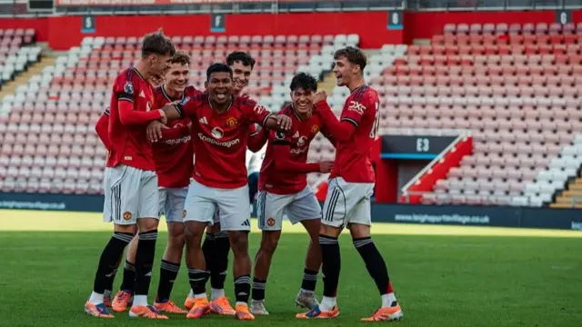 Manchester United's Paraguay international defender Diego Leon (centre) celebrates his goal in the Premier League 2 victory against Tottenham 