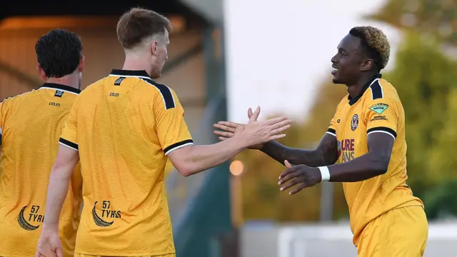 Shaquille Gwengwe celebrates scoring for Newport County at Newport City