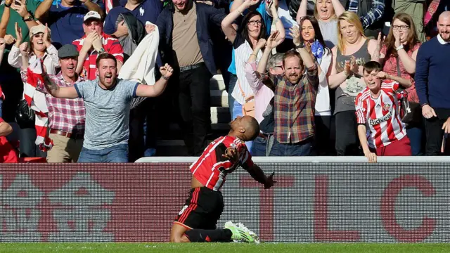 Jermain Defoe celebrates the opening goal on the ground during the Barclays Premier League match between Sunderland AFC and Newcastle United at the Stadium of Light 
