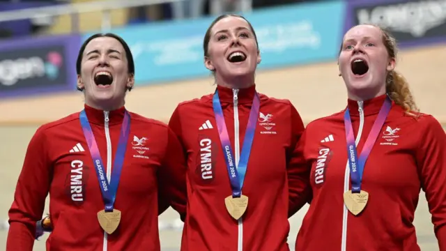 Rhian Edmunds, Lowri Thomas and Emma Finucane sing the national anthe