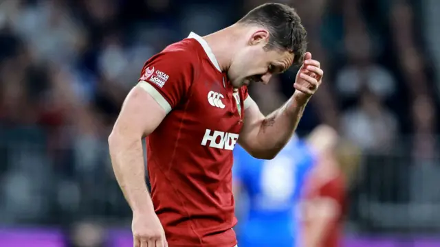 Tomos Williams leaves the pitch injured