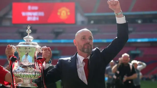 Erik ten Hag celebrates with FA Cup trophy