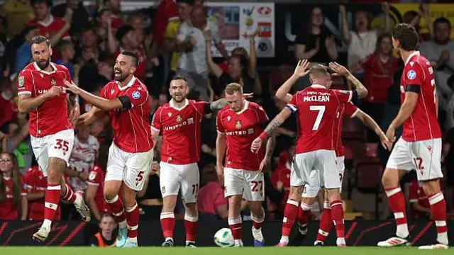 Wrexham players celebrate against Hull 