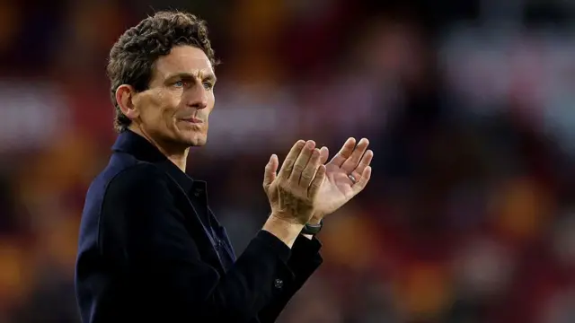 Brentford boss Keith Andrews applauds fans after defeat by Manchester City