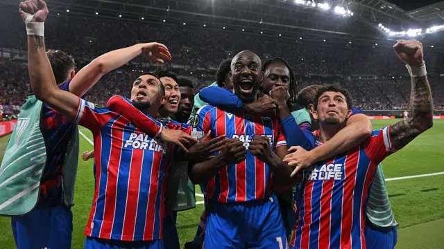 Crystal Palace celebrate their goal in the Europa Conference League final. Players mob Mateta. 
