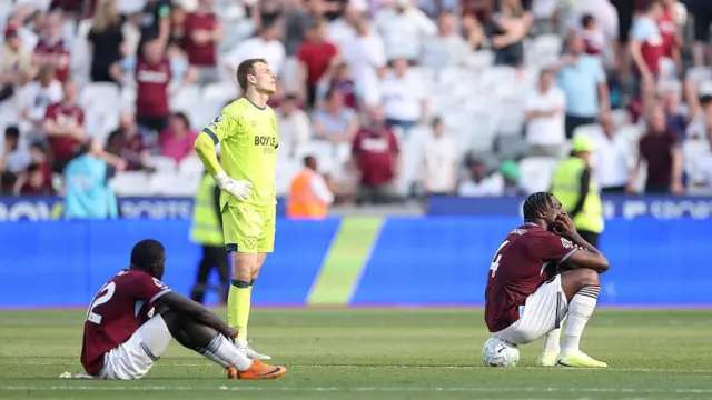 El Hadji Malick Diouf, Mads Hermansen and Axel Disasi of West Ham United look dejected.