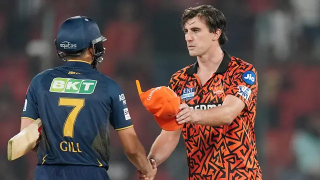 Pat Cummins and Shubman Gill shake hands
