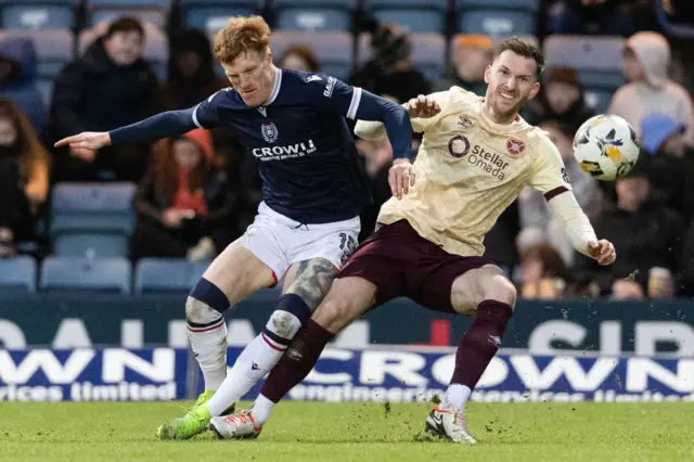 Simon Murray battles for possession with Jamie McCart