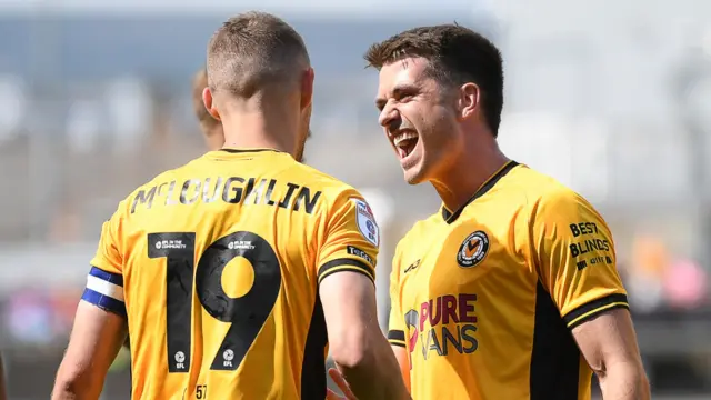 Newport County's Shane McLoughlin and Ollie Greaves celebrate