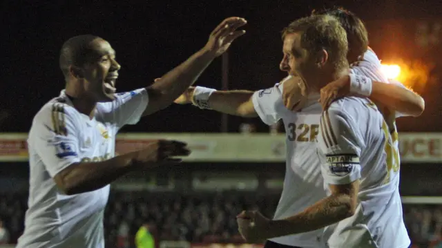 Garry Monk celebrates with Luke Moore at Crawley in 2012 
