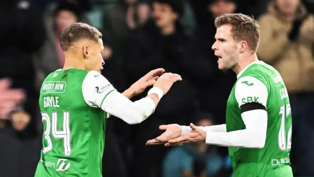 Dwight Gayle celebrates with Nicky Cadden after scoring against Ross County