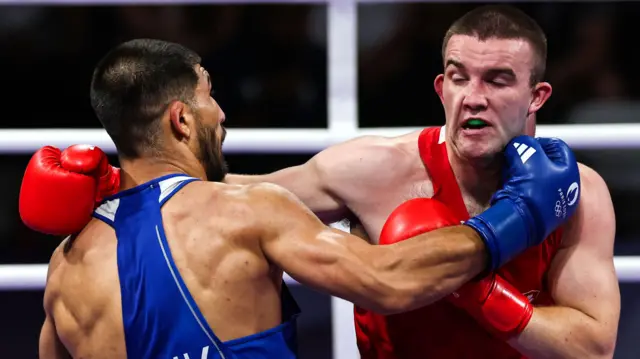 Davlat Boltaev and Jack Marley exchange blows in the Paris quarter-final