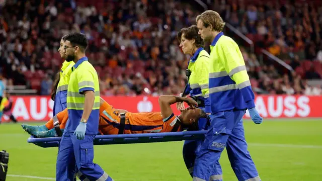 Nathan Ake is stretchered off