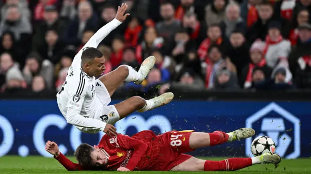 Conor Bradley tackling Kylian Mbappe 