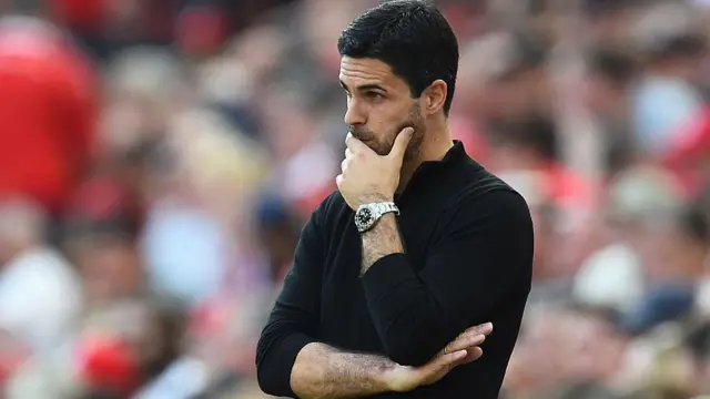 Mikel Arteta looks on thoughtfully