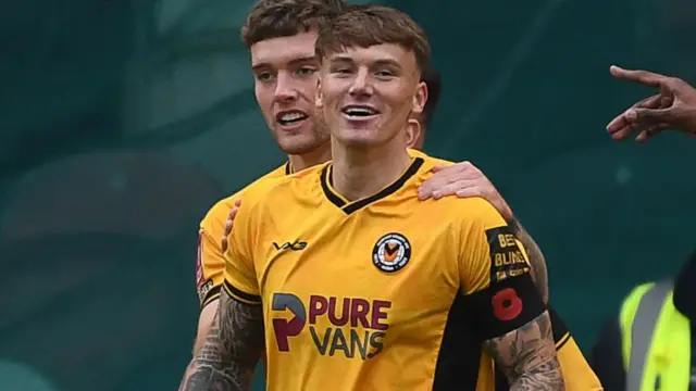 Kai Whitmore celebrating his goal for Newport County against Peterborough United